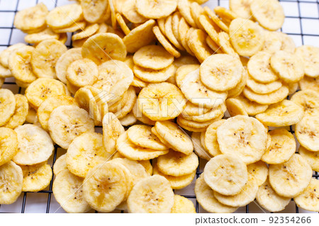 Banana slice chips on white background. 92354266