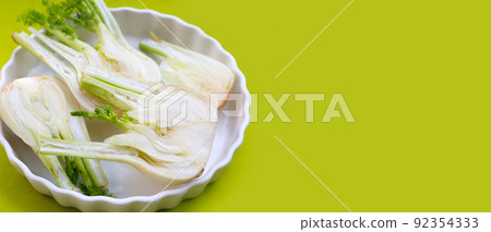 Fresh fennel bulb on green background. Copy space Fresh fennel bulb on green background. Copy space 92354333