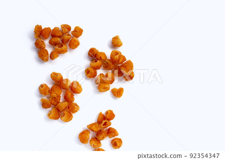 Dried longan on white background. 92354347