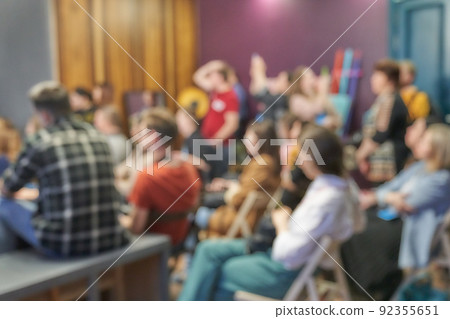 Blurred background of the business conference, presentation of the project, public talk. Coloured background. Copy space. Audience on the event, group of people on the training.  92355651