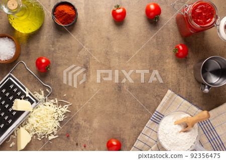Pizza ingredients on table. Bread recipe homemade at tabletop background 92356475