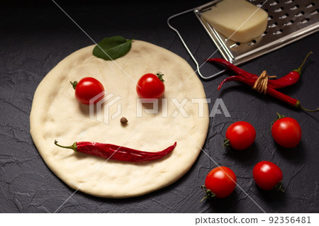 Pizza or dough for bread with ingredients at table. Pizza recipe homemade at tabletop background 92356481