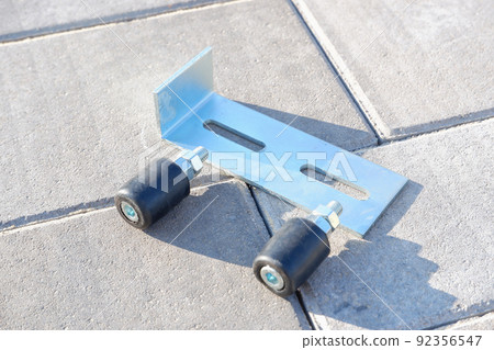 Sliding gate fittings. Gate rollers close up 92356547