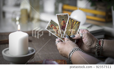 Concept of psychic advisor or ways of divination with cards. Concept of psychic advisor or ways of divination with cards. 92357311
