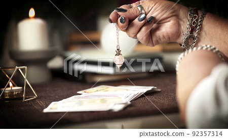 Concept of psychic advisor or ways of divination with cards. 92357314