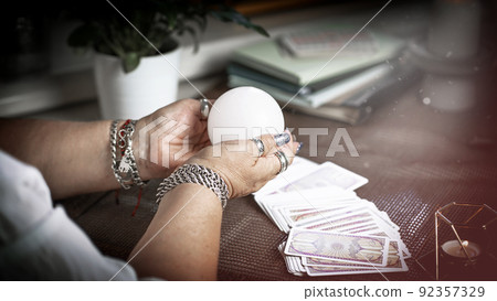 Concept of psychic advisor or ways of divination with cards. Concept of psychic advisor or ways of divination with cards. 92357329