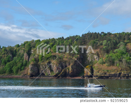 the scotish coast and a castle in the highlands 92359025