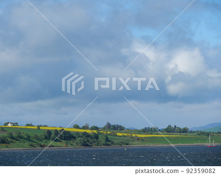 the scotish coast and a castle in the highlands 92359082