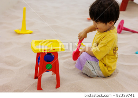 Children playing in the sandbox Children playing in the sandbox 92359741