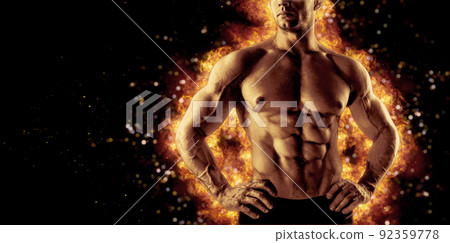 Brutal strong athletic Bodybuilder posing. Fire and spark explosion in the background. Brutal strong athletic Bodybuilder posing. Fire and spark explosion in the background. 92359778