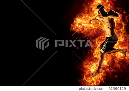 Fighter man in fire. Sport advertising. MMA boxer 92360129
