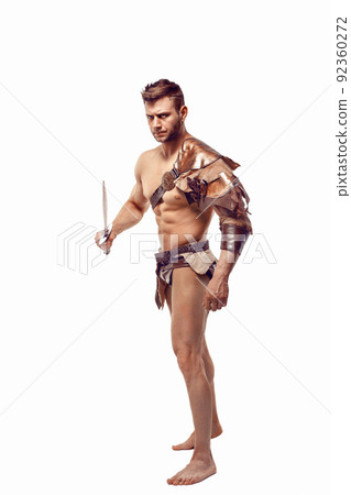 Portrait of handsome muscular gladiator with sword. Isolated. Studio shot. Portrait of handsome muscular gladiator with sword. Isolated. Studio shot. 92360272