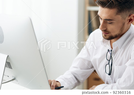 businessmen wearing glasses sits at a desk office worked technologies businessmen wearing glasses sits at a desk office worked technologies 92360316