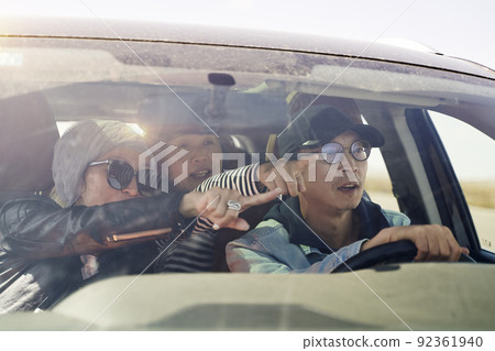 group of asian tourists traveling by car and having a good time group of asian tourists traveling by car and having a good time 92361940