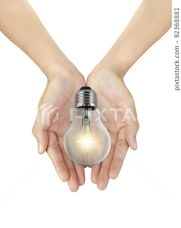 Beautiful woman hand holding a bulbs that shine glitter on a white isolated background Beautiful woman hand holding a bulbs that shine glitter on a white isolated background 92368881
