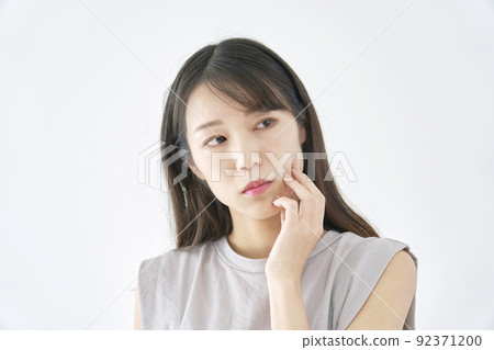 Thinking woman white background Thinking woman white background 92371200