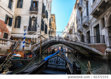 Venice canal gondola ride Venice canal gondola ride 92372333