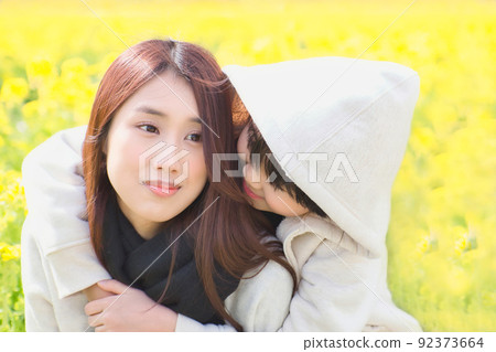 Rape blossoms and good friends sisters 92373664