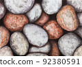 Natural background of stones on the beach, pebbles. Hand-drawn illustration with colored pencils 92380591
