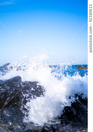 Rough waves of the sea hitting rocks Rough waves of the sea hitting rocks 92380613
