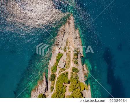 Picturesque sea Adriatic coast of Montenegro. Turquoise Mediteran sea and rocky shore with evergreen coniferous trees. Wonderful summer landscape. Drone Portrait of a disgruntled girl sitting at a Picturesque sea Adriatic coast of Montenegro. Turquoise Mediteran sea and rocky shore with evergreen coniferous trees. Wonderful summer landscape. Drone Portrait of a disgruntled girl sitting at a 92384684