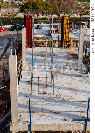 Concrete floor slab with rebars in a residential building under construction 92385548