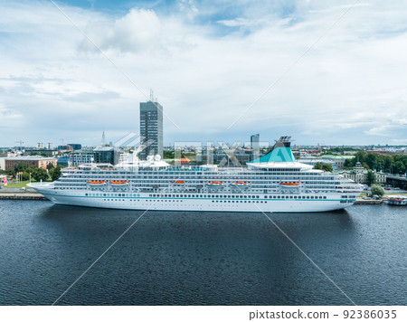 Beautiful cruise ship docked in Riga, Latvia near the old town and the bridge. Beautiful cruise ship docked in Riga, Latvia near the old town and the bridge. 92386035