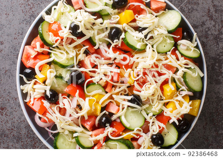 Shopska salata vegetables Chopped Salad with cheese closeup in the plate. Horizontal top view 92386468