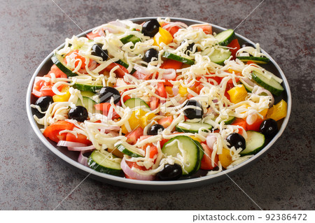 Shopska salata vegetables Chopped Salad with cheese closeup in the plate. Horizontal 92386472