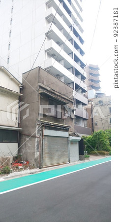 Urban high-rise condominiums and ruins 92387181