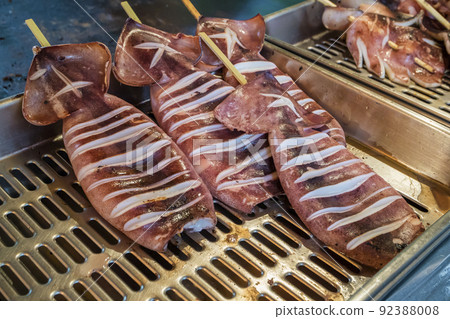 Squid grilled squid grilled squid skewered squid skewered fair food ingredients stall Squid grilled squid grilled squid skewered squid skewered fair food ingredients stall 92388008