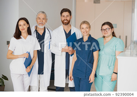 Portrait of a group of happy and successful doctors and nurses in hospital 92390004