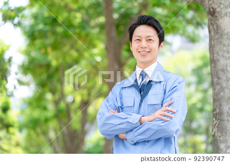 Men in work clothes outdoor fresh green real estate architecture 92390747