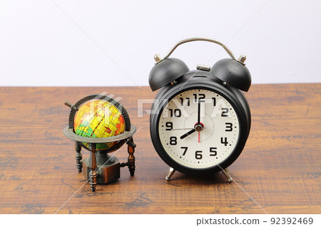 Alarm clock and globe time difference image 92392469