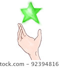 拿著綠色星的手 92394816
