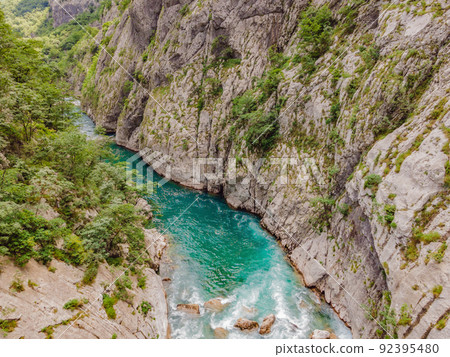 The purest waters of the turquoise color of the river Moraca flowing among the canyons. Travel around Montenegro concept Portrait of a disgruntled girl sitting at a cafe table The purest waters of the turquoise color of the river Moraca flowing among the canyons. Travel around Montenegro concept Portrait of a disgruntled girl sitting at a cafe table 92395480