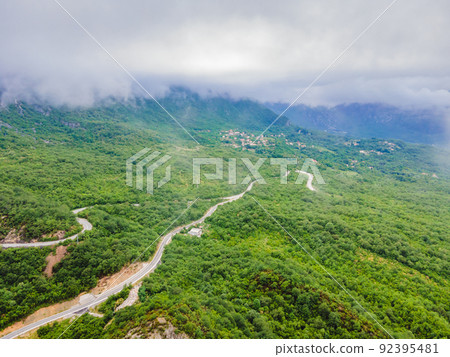 Beautiful view of the mountains of Montenegro and Skadar lake Portrait of a disgruntled girl sitting at a cafe table Beautiful view of the mountains of Montenegro and Skadar lake Portrait of a disgruntled girl sitting at a cafe table 92395481