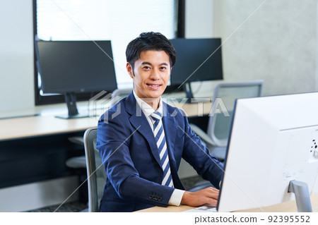 Young businessman in a suit Young businessman in a suit 92395552