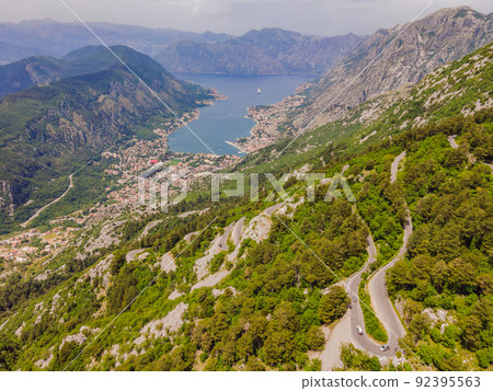 Aerial view on the Old Road serpentine in the national park Lovcen, Montenegro Portrait of a disgruntled girl sitting at a cafe table 92395563