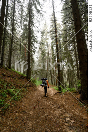 Tourist hike with large backpacks in the Carpathians. 92396121