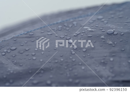 Raindrops on a blue tent close-up. Raindrops on a blue tent close-up. 92396150