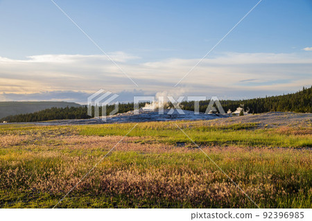 Sunset view of the Old Faithful geyser Sunset view of the Old Faithful geyser 92396985