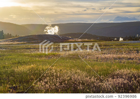 Sunset view of the Old Faithful geyser Sunset view of the Old Faithful geyser 92396986