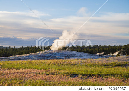 Sunset view of the Old Faithful geyser Sunset view of the Old Faithful geyser 92396987