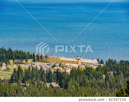 Sunny beautiful high angle view of the Yellowstone Lake landscape and Lake Yellowstone Hotel in Yellowstone National Park Sunny beautiful high angle view of the Yellowstone Lake landscape and Lake Yellowstone Hotel in Yellowstone National Park 92397134