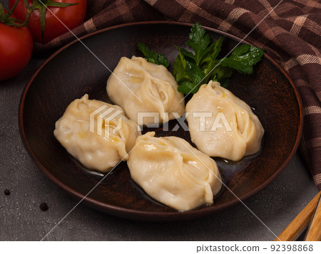 a traditional Uzbek dish with chopped meat and vegetables filling. manty or manti a traditional Uzbek dish with chopped meat and vegetables filling. manty or manti 92398868