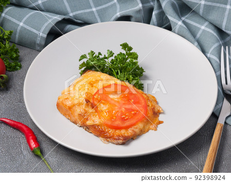fillet of red fish with cheese and tomato fillet of red fish with cheese and tomato 92398924