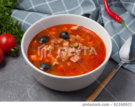 solyanka is a traditional Russian soup with assorted meat and sausages solyanka is a traditional Russian soup with assorted meat and sausages 92398925