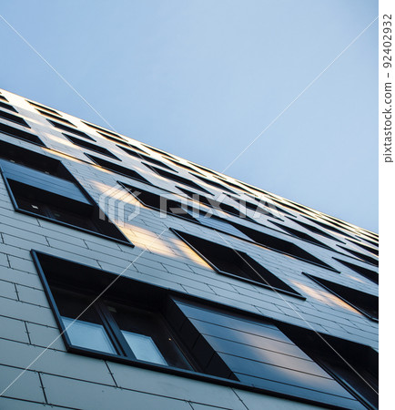 view on new modern buildings, facade corner and sky, real houses on line close up 92402932