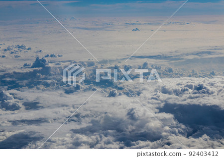 Summer clouds seen from an airplane Summer clouds seen from an airplane 92403412